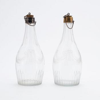 A pair of late gustavian glass and silver vinegar bottles, circa 1800.