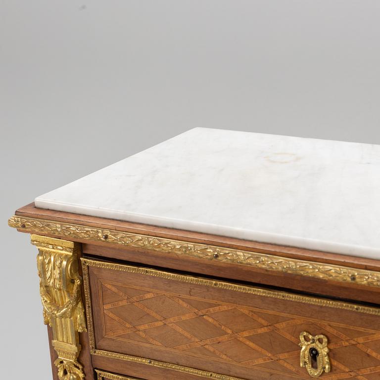 A Louis XVI-style chest of drawers, circa 1900.