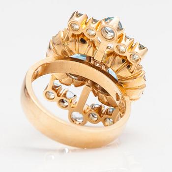 An 18K gold ring "Sophia Albertina" with diamonda ca. 0.54 ct in total and topazes. Ofelia Jewelry, Helsinki 1998.