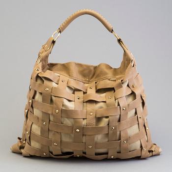 A Salar Juni Woven Shoulder Bag.