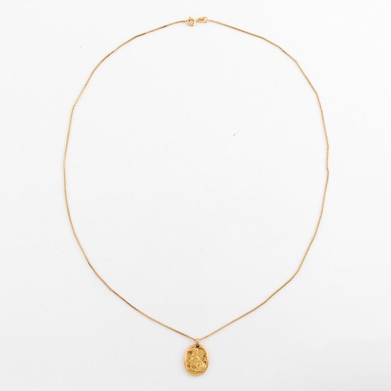 A Cartier Leo zodiac pendant.