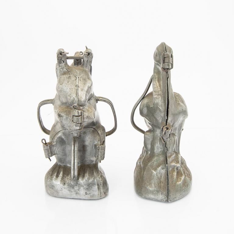 A set of four pewter icecream moulds around 1900.