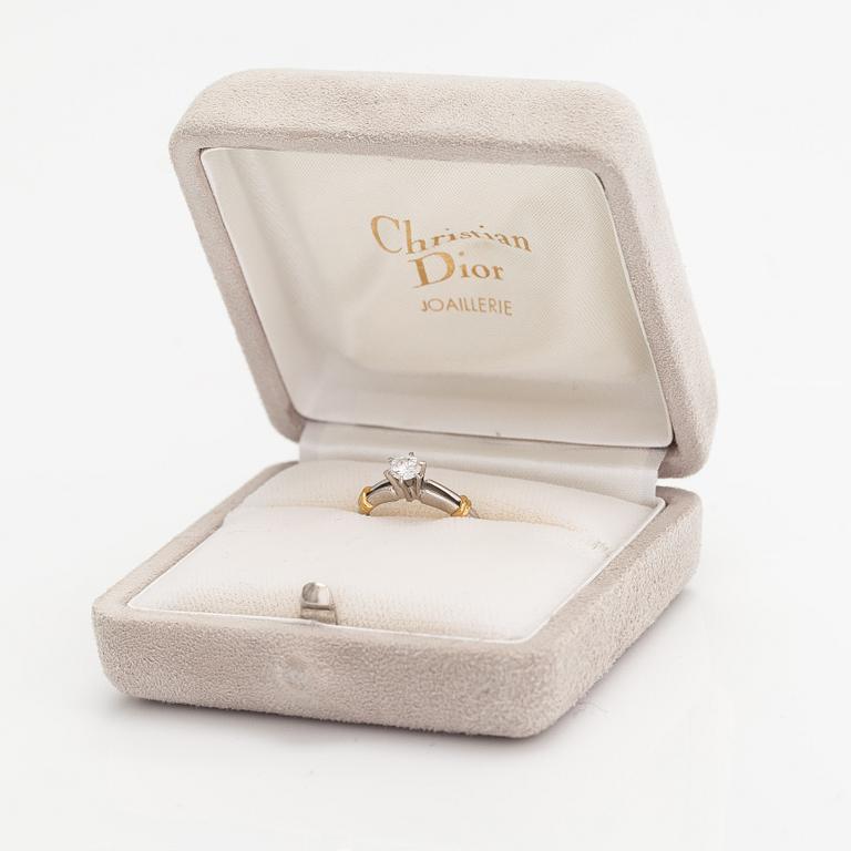 Dior, An 18K gold and platinum ring with a ca. 0.271 ct diamond. Marked CH Dior, 542.