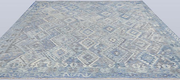 A Kilim carpet, approx. 375 x 311 cm.