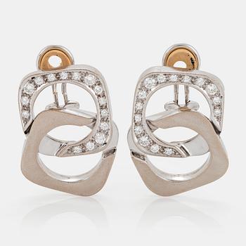 1105. A pair of 18K white gold earrings set with round brilliant-cut diamonds.