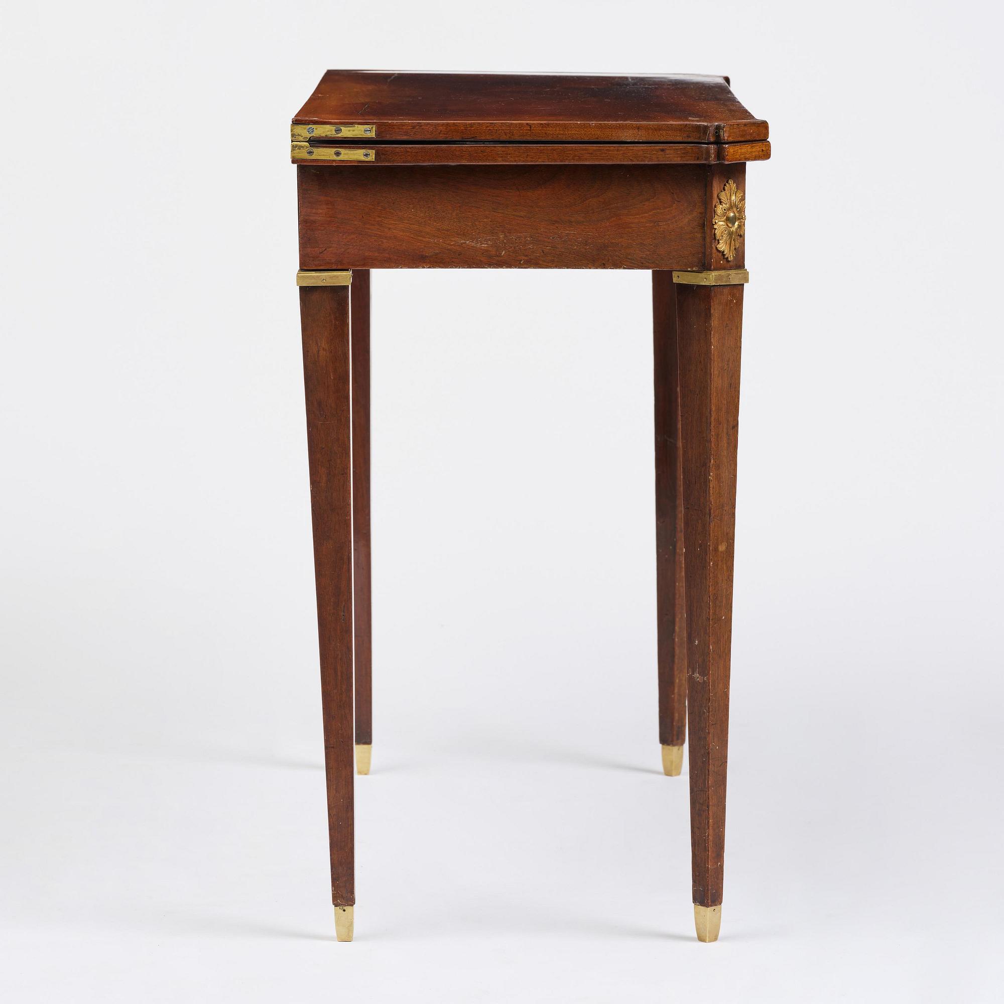 A Gustavian 'concertina action' mahogany games table by Georg Haupt (master in Stockholm 1770-84).