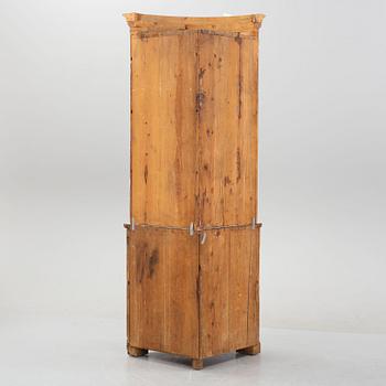 An 19th Century corner cabinet.