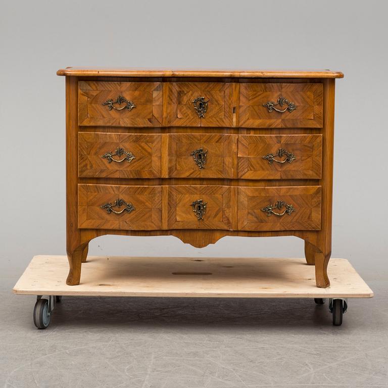 A baroque style chest of drawers circa 1900.