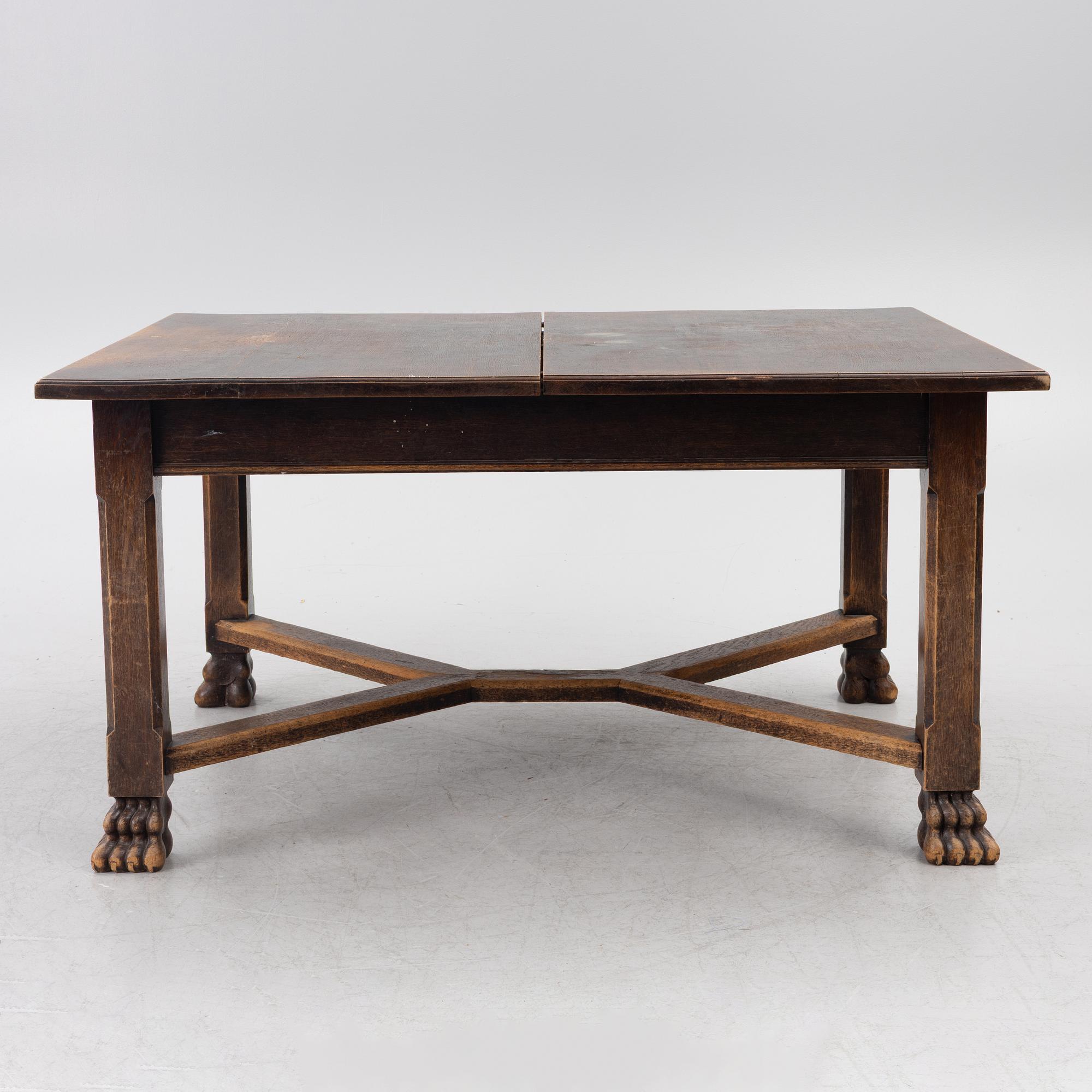 A Baroque-style dining table with six chairs, around 1900.