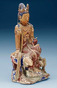 1695. A seated wooden figure of Guanyin, Yuan/Ming dynasty.