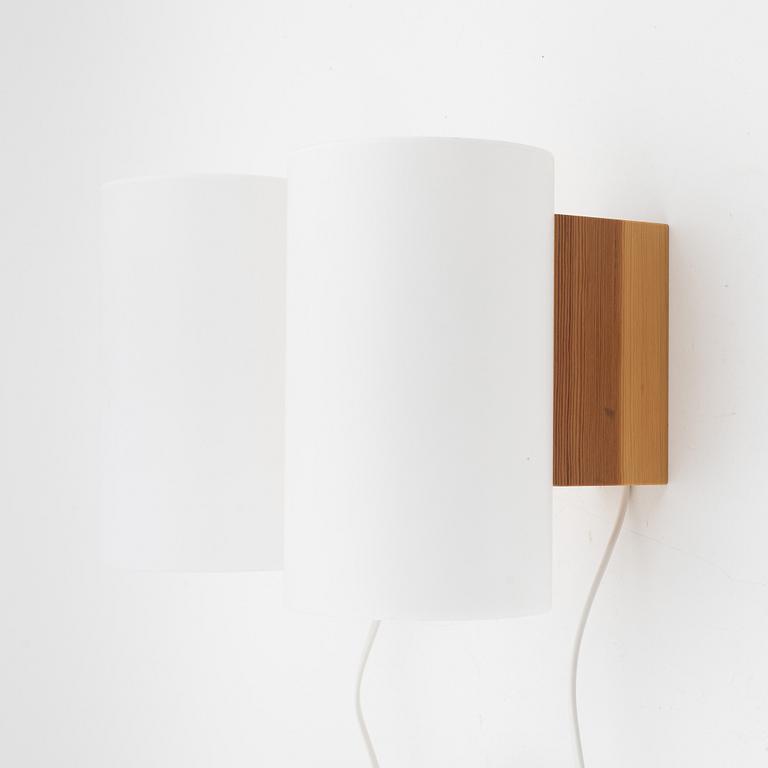 A pair of pine and acrylic wall lights, Luxus, Vittsjö.