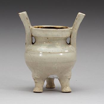 A pale grey-bluish glazed tripod censer with decor in relief, and archaistic mark, Ming dynasty (1368-1644).