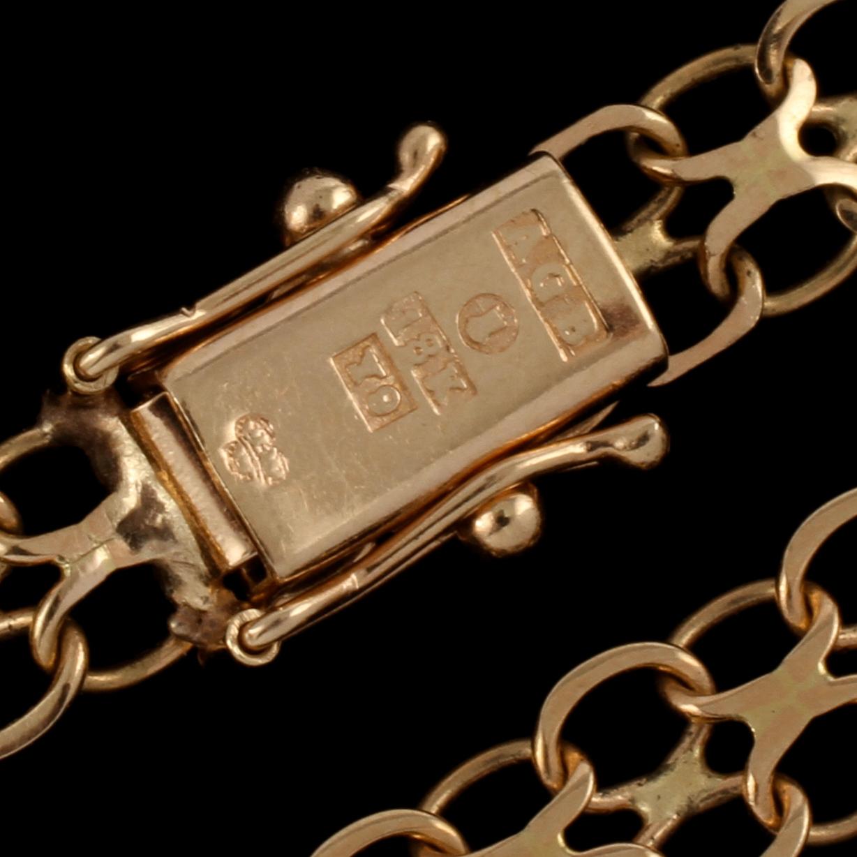 BERLOCKARMBAND, 18k guld samt emalj, Bäckman & Co, Stockholm, 1973. Vikt 9 g.