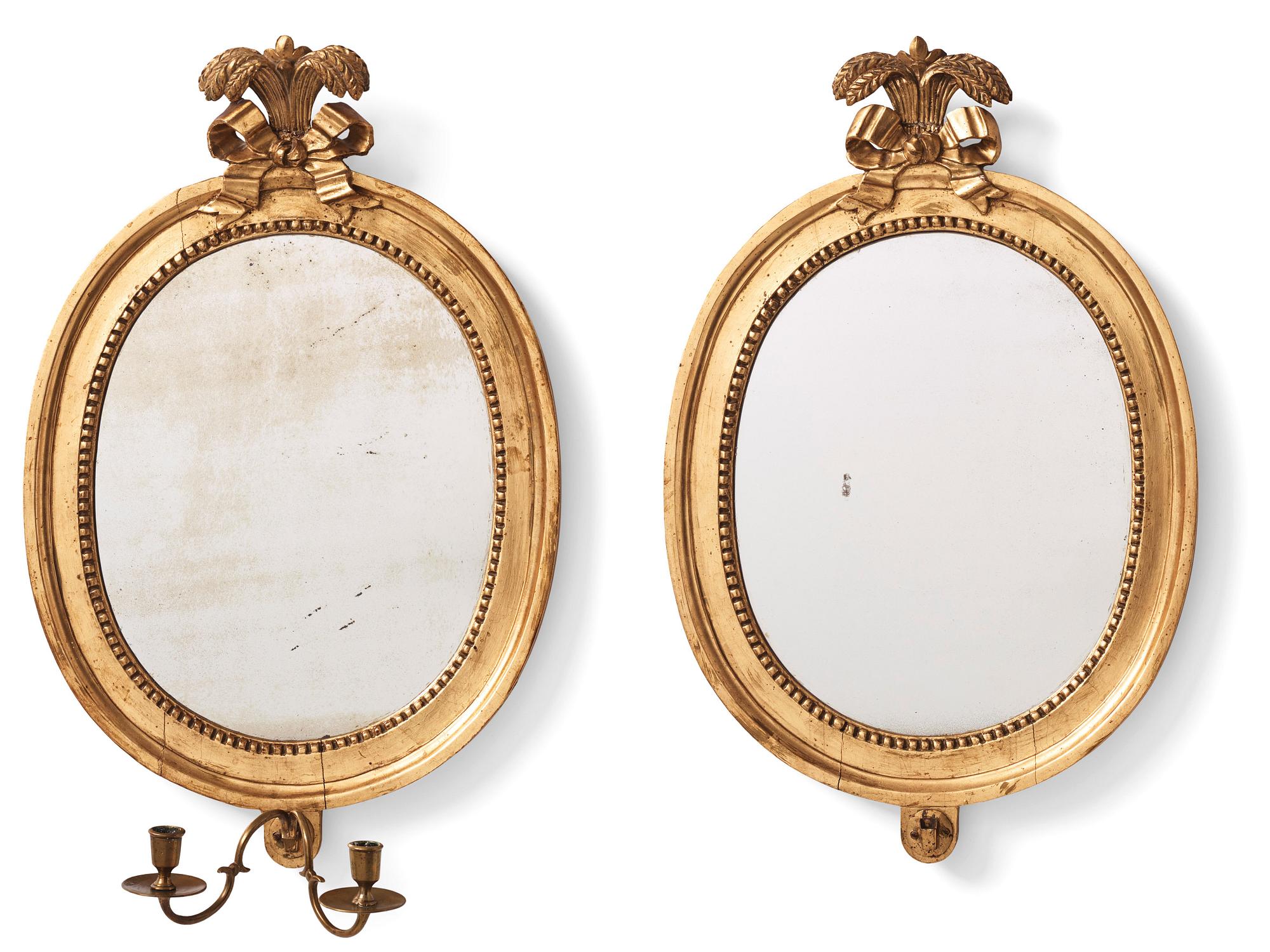 A pair of Gustavian two-light giltwood girandoles by J. Åkerblad (master 1756-1799).