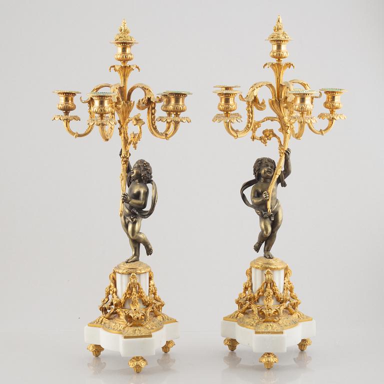 A pair of bronze and marble candelabra, possibly France, late 19th century.