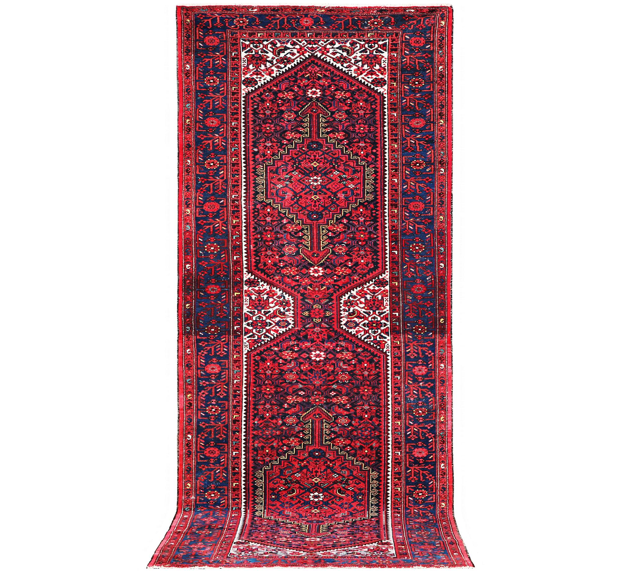 A Hosseinabad carpet, c. 391 x 135 cm.