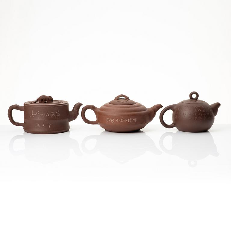 A group of three Chinese yixing teapots, 1960-80s.