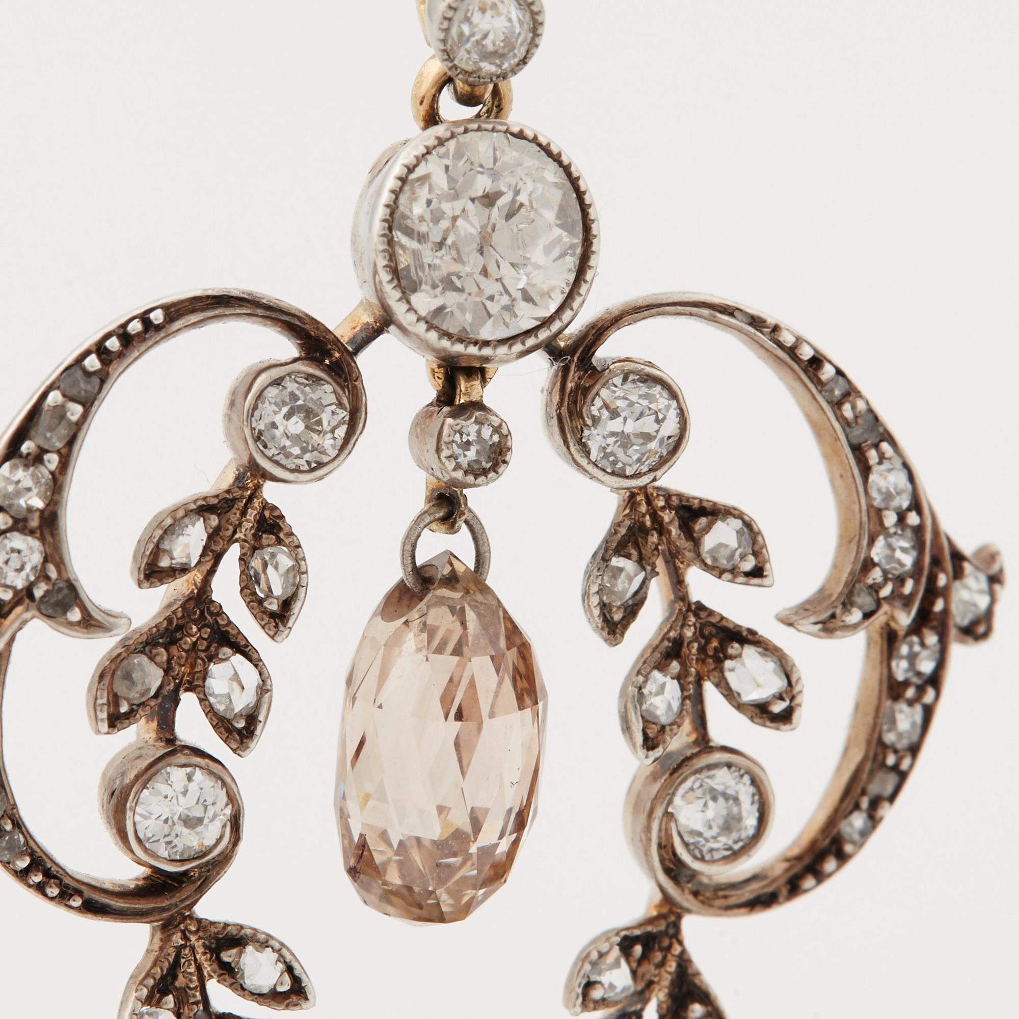 A natural pearl, old-, rose-and briolette cut diamond pendant. Early 20th cent.