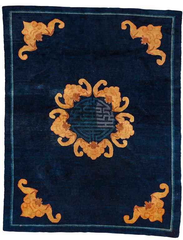 A carpet, a semi-antique Chinese,  ca 255 x 199-202,5 cm.