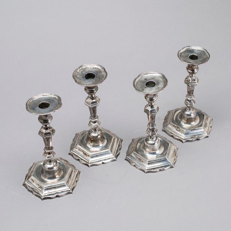 Two simular pairs of candlesticks, two marked Barde, Geneve 18th century, two with later marks.