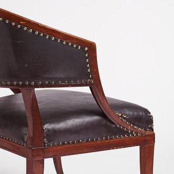 A near pair of mahogany open armchairs, one late Gustavian, Stockholm circa 1800.