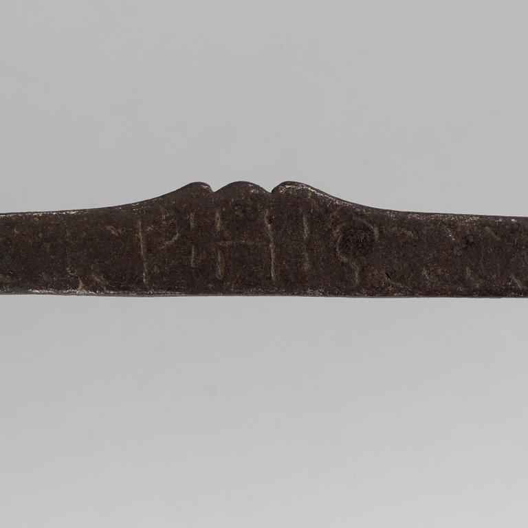 A 18th century hacksaw dated 1728.