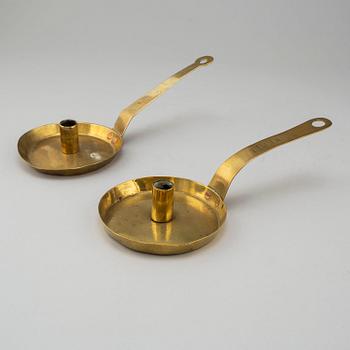 Two 18th century brass candlesticks.