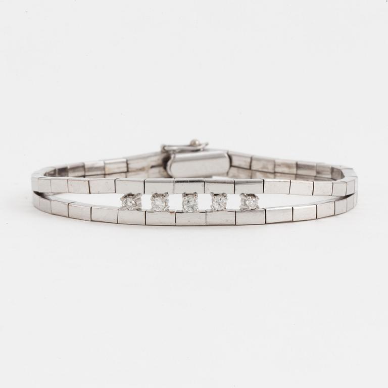 An Omega-link bracelet set with round, brilliant-cut diamonds.