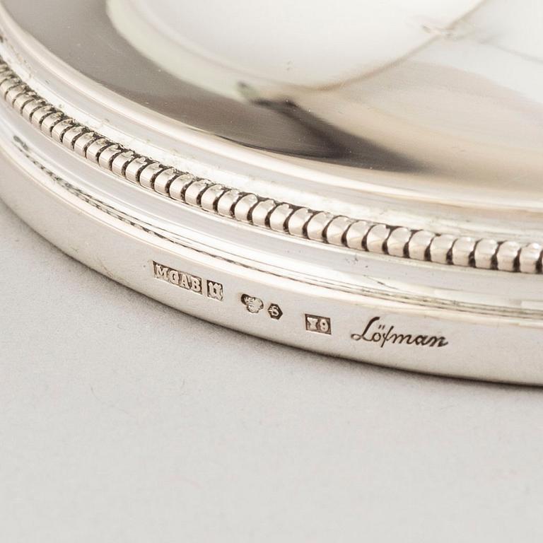 A set of four Swedish silver candlesticks, maker's mark Erik Löfman, Uppsala 1971-1973.