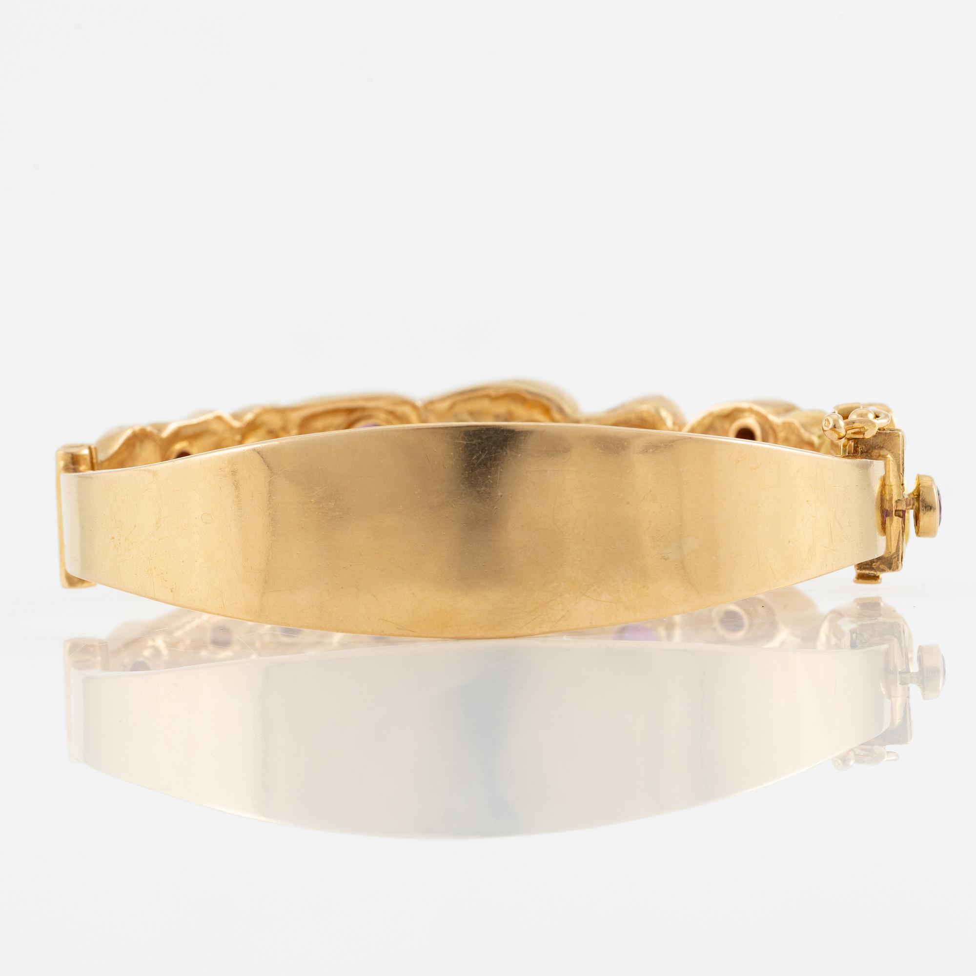 Bracelet, Robbert, 18K gold with red stones. Trosa 1971.