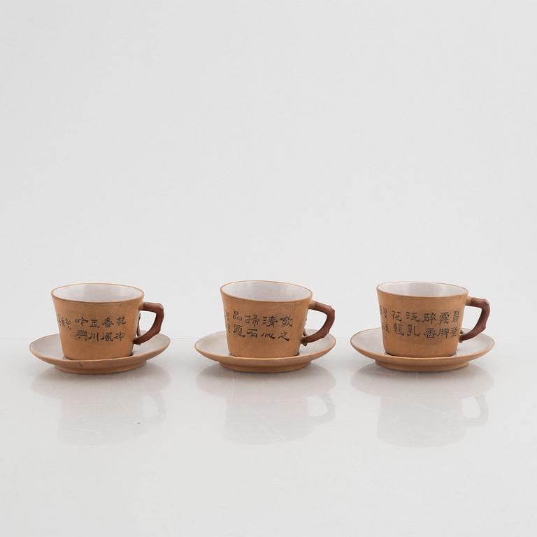 Three Yixing cups with saucers and a bowl, china, early 20th century.