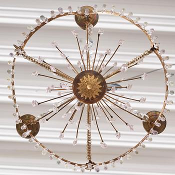 A Gustavian gilt brass and cut glass four-light chandelier, Stockholm, late 18th century.