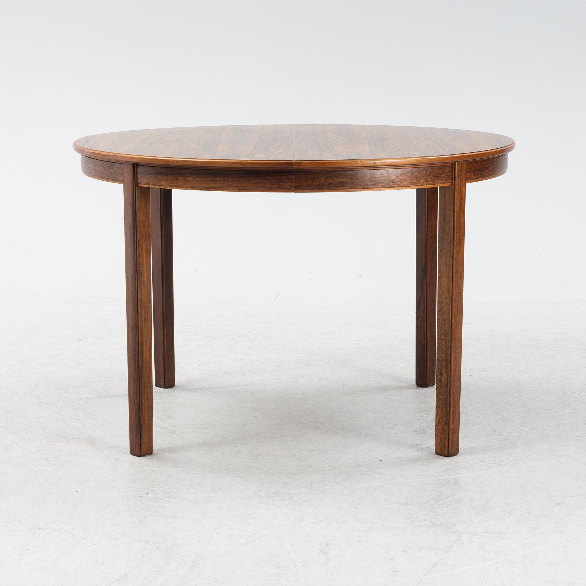 A 1960's/70's rosewood veneered dining group.