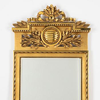 A Gustavian style mirror, mid 20th century.