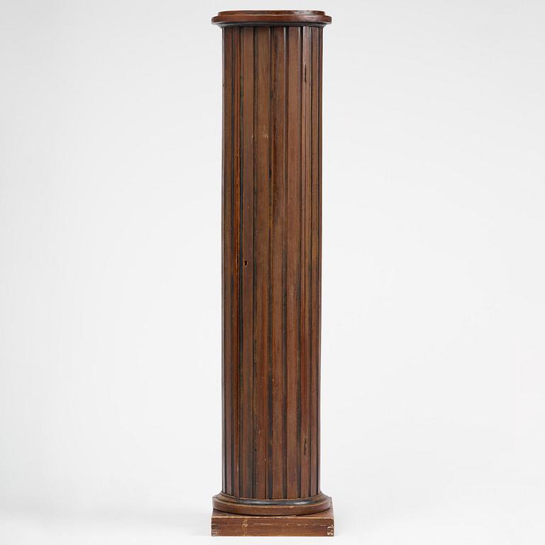 A Swedish Empire column-shaped cabinet, first part 19th century.
