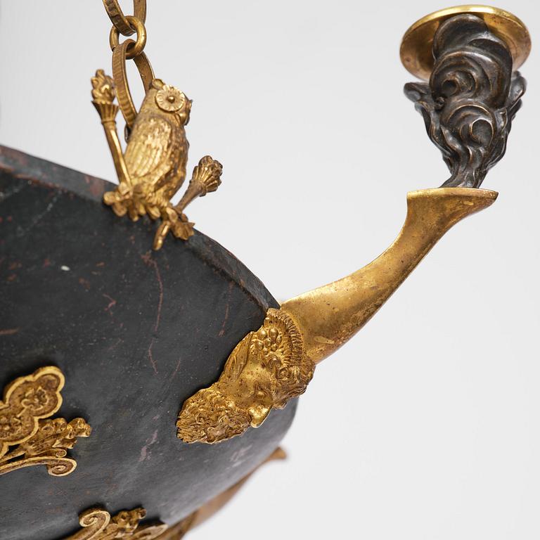 A patinated and ormolu six-light Empire chandelier, Stockholm, first part 19th century.