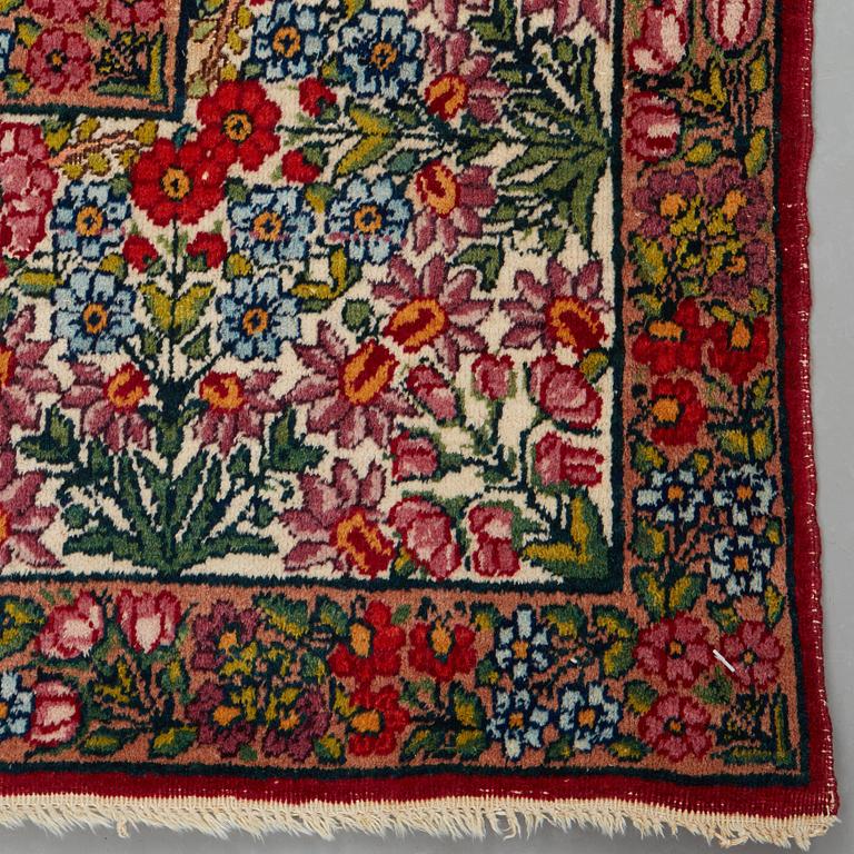 A RUG, a semi-antique Kerman "mille-fleur", ca 198,5 x 136,5 cm.