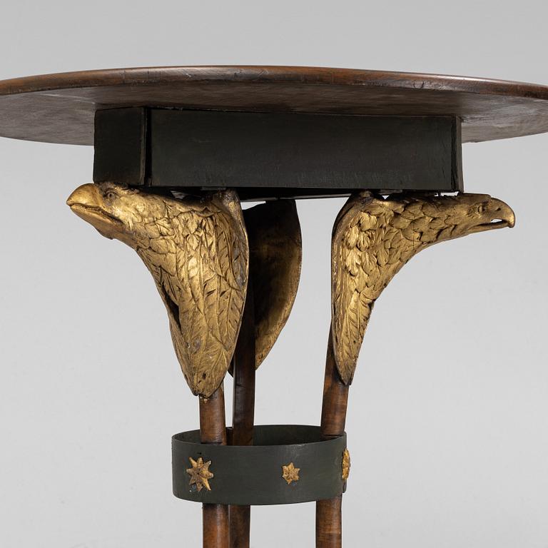 A presumably Russian giltwood and walnut Empire table, early 19th Century.