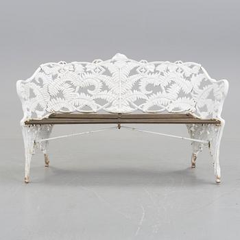 A WHITEPAINTED EARLY 20TH CENTURY SWEDISH AGGENBERG CAST IRON AND WOOD GARDEN SOFA.