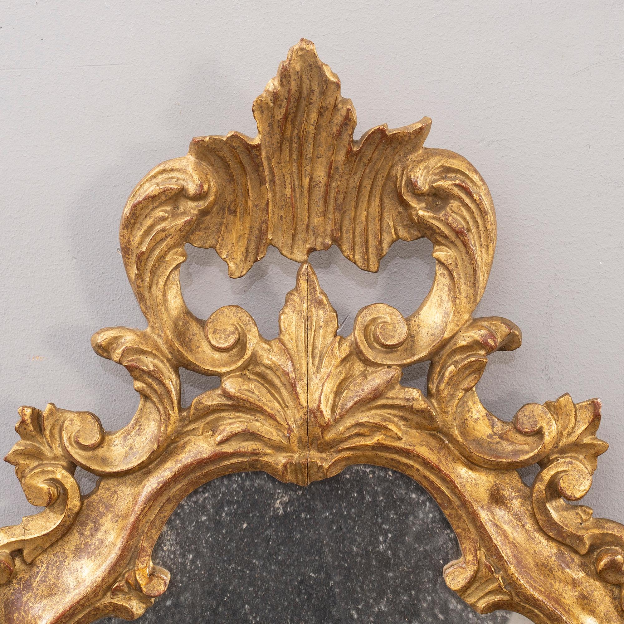 A pair of mid 20th century wood mirrors in LouisXV-style from Paoletti, Firenze Italy.