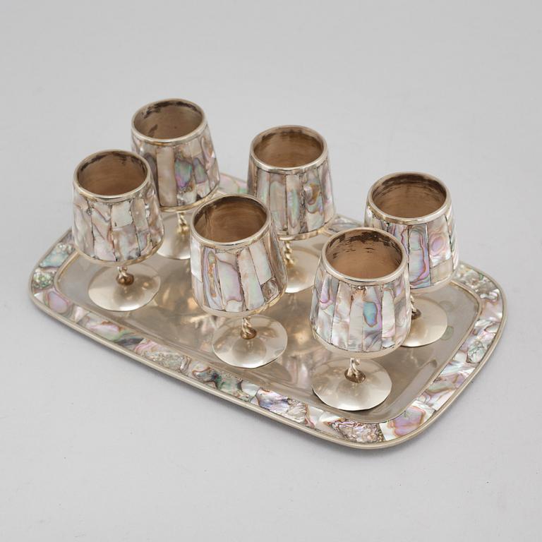 Six liqeur glasses on a tray, mother of pearl and alpaca, Mexico, second half of the 20th century.