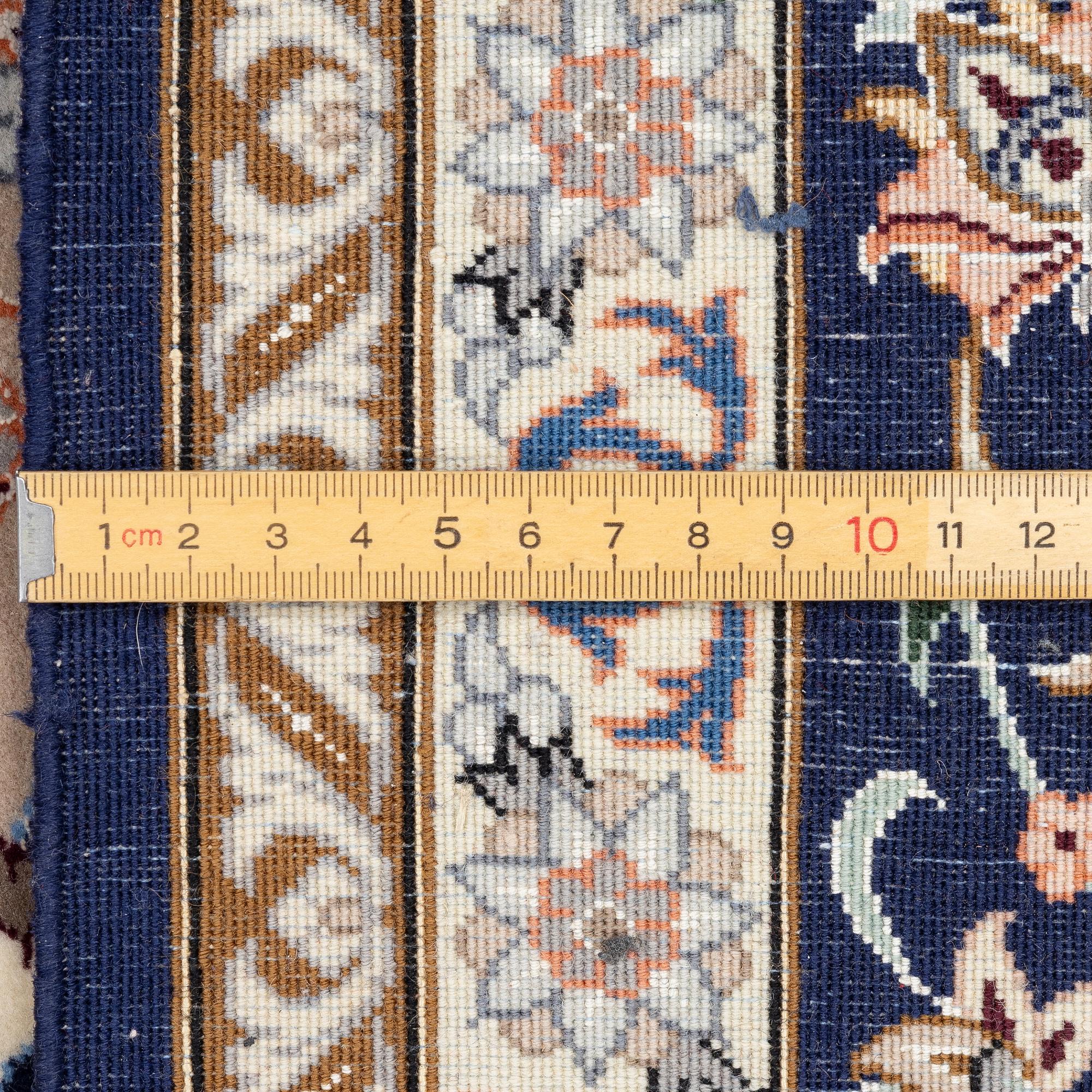 An Isfahan rug, c. 220 x 145 cm.