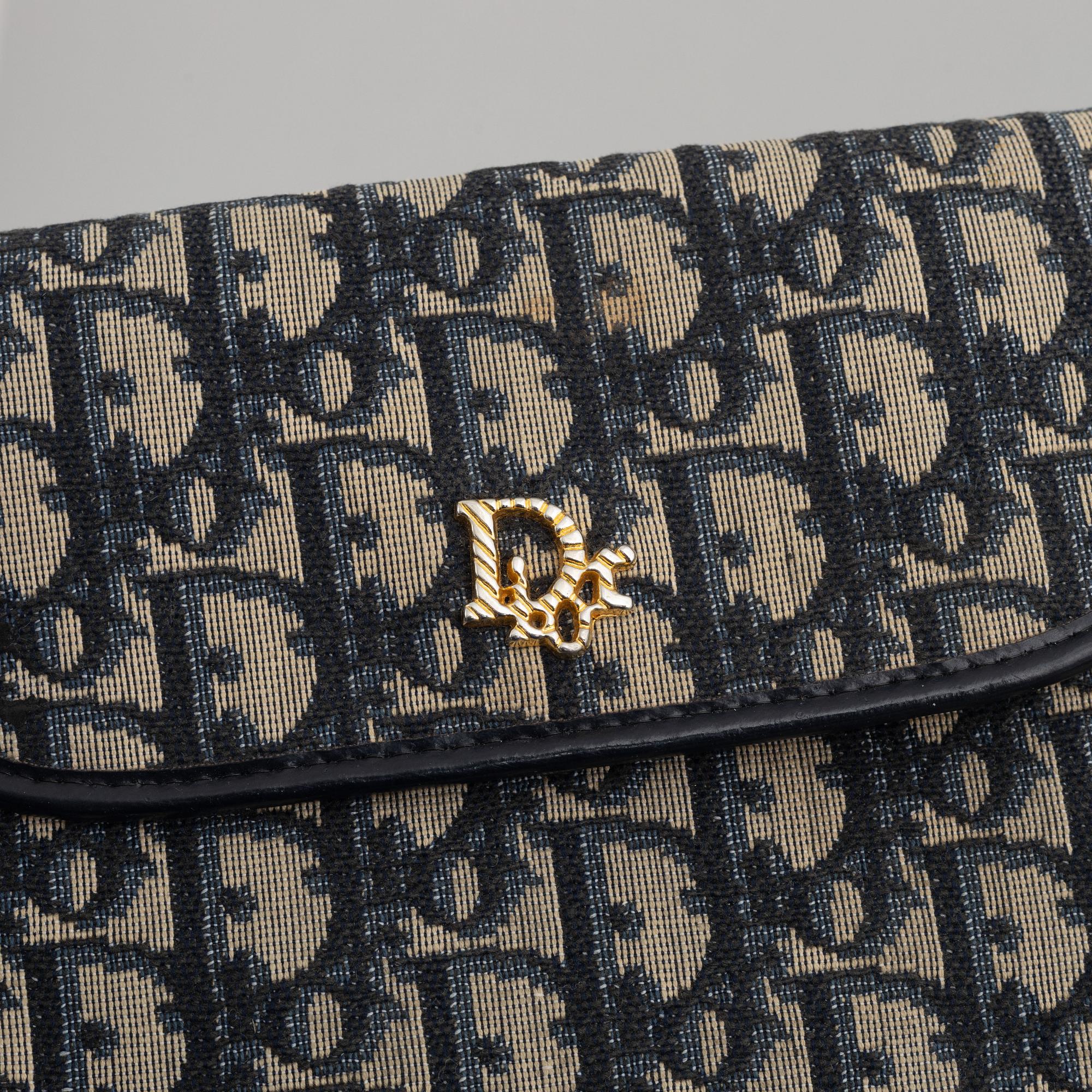 Christian Dior, a handbag/clutch.