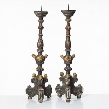 A pair of Baroque style candleholders, 19th Century.