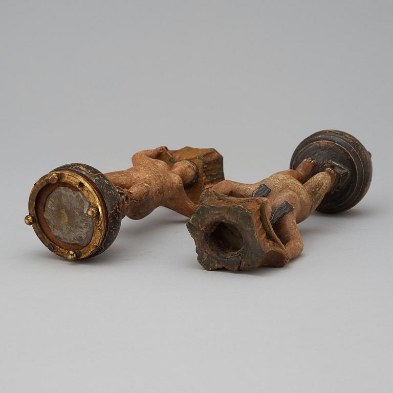 A pair of Swedish 19th century wooden candlesticks.