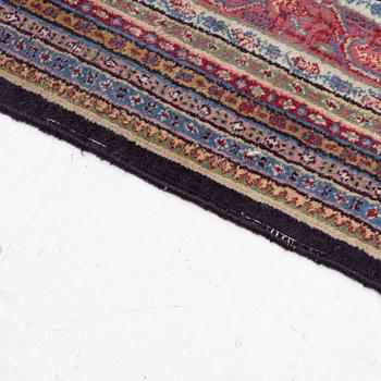 A oriental carpet, signed, c. 295 x 295 cm.
