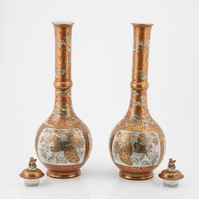 A pair of large Japanese porcelain vases with covers, Meiji period (1868-1912).