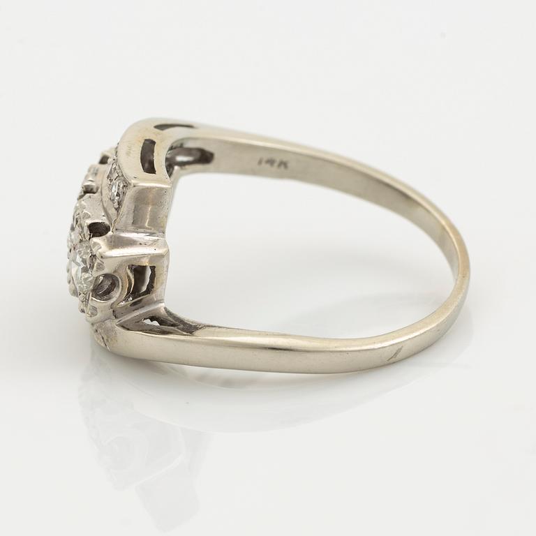A 14K gold ring set with diamonds.