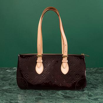 A Louis Vuitton bag,  "Rosewood Avenue Amarante".