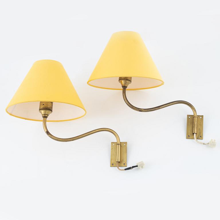 A pair of brass wall lamps.